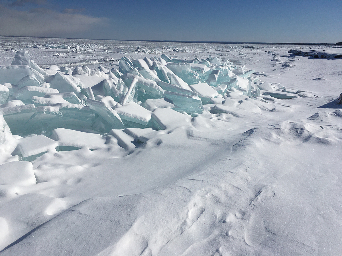 Hummocked or piled plates or sheets of ice along the shore of Lake Superior.