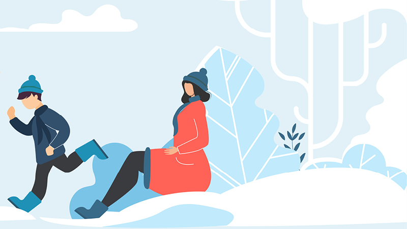 Simple illustration of a woman sitting in the snow next to a boy playing