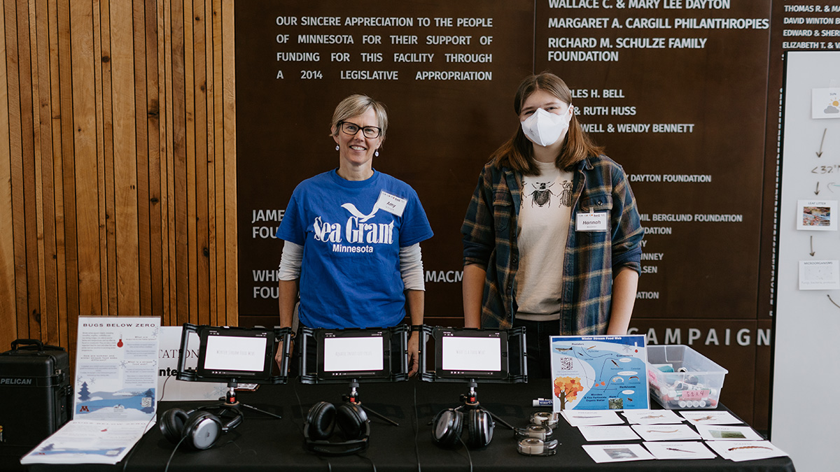 Two people tabling at an event.