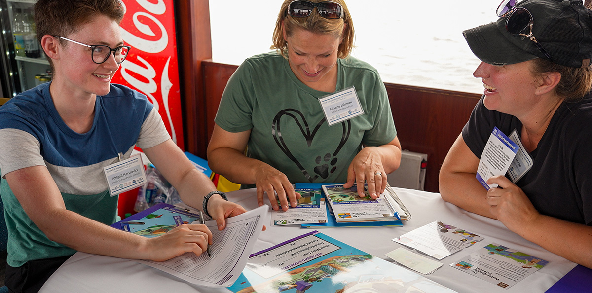 Educators playing the Minnesota Sea Grant Watershed Game aboard the Vista Queen.