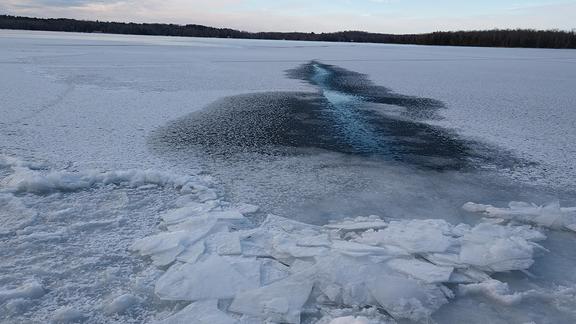 Partially frozen plate ice on a lake