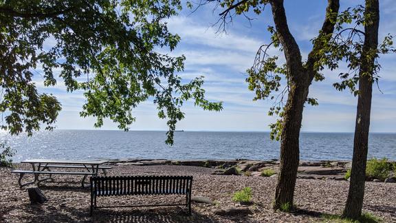 Bench and picnic table on Brighton Beach in Duluth, Minnesota.