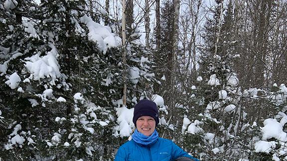 1854 Treaty Authority Climate Biologist Hilarie Sorensen conducting snow depth monitoring at Stone Lake in February 2022.