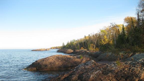 Rocky and forested coastline along Lake Superior.