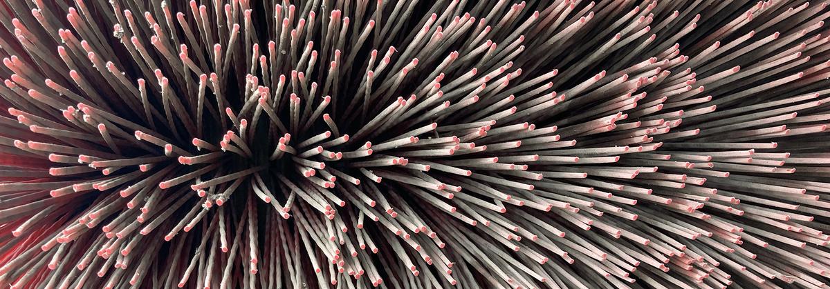 Close-up view of bristles on a truck's street sweeper brush.