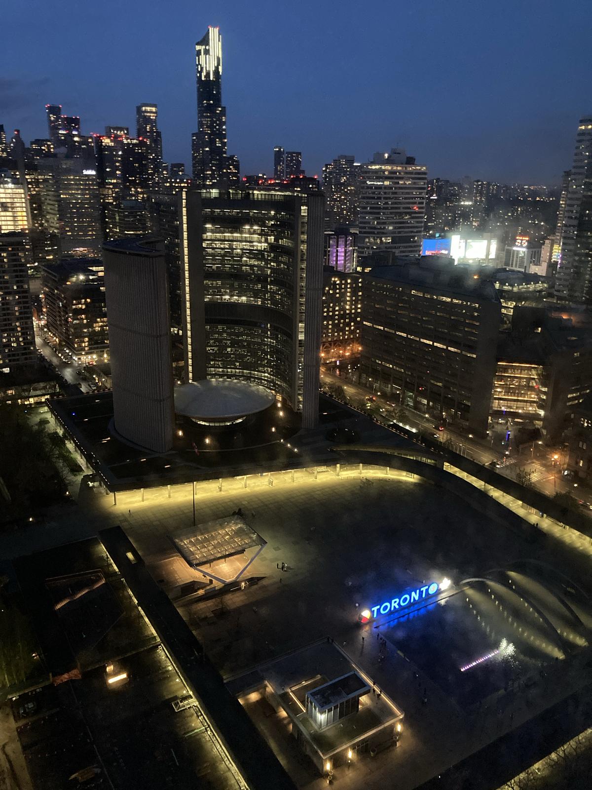 Toronto skyline at night with buildings illuminated