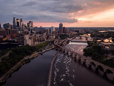Aerial shot of St. Anthony Falls in Minneapolis, Minnesota, at sunset.