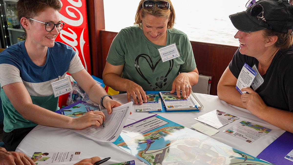 Educators playing the Minnesota Sea Grant Watershed Game aboard the Vista Queen.