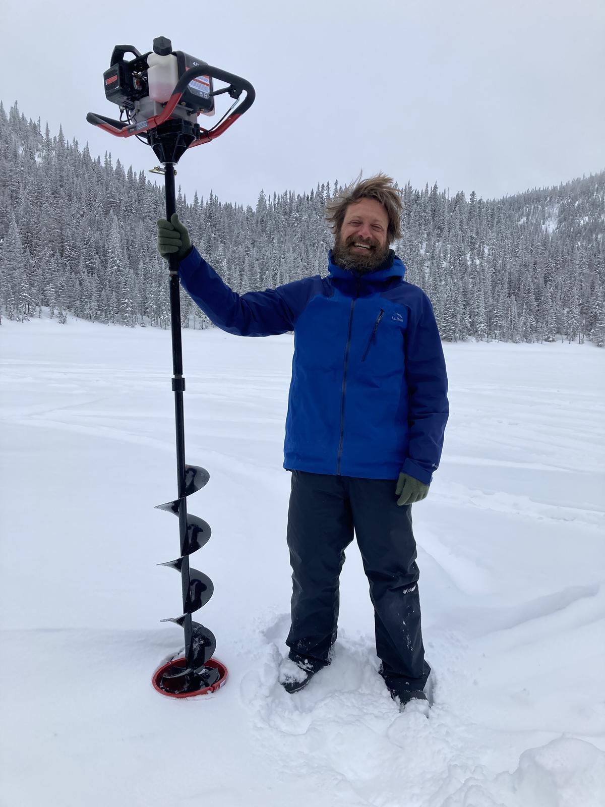 Ted Ozersky holds an ice auger.