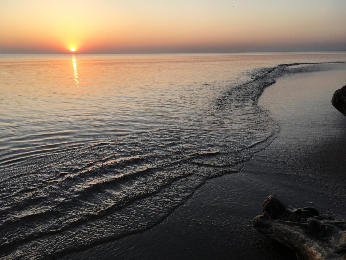A sunrise over Lake Superior shore.