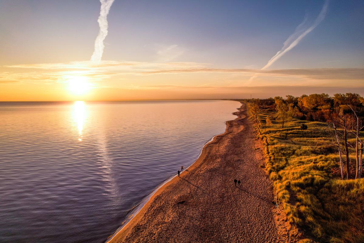 A sunrise over a Lake Superior beach.