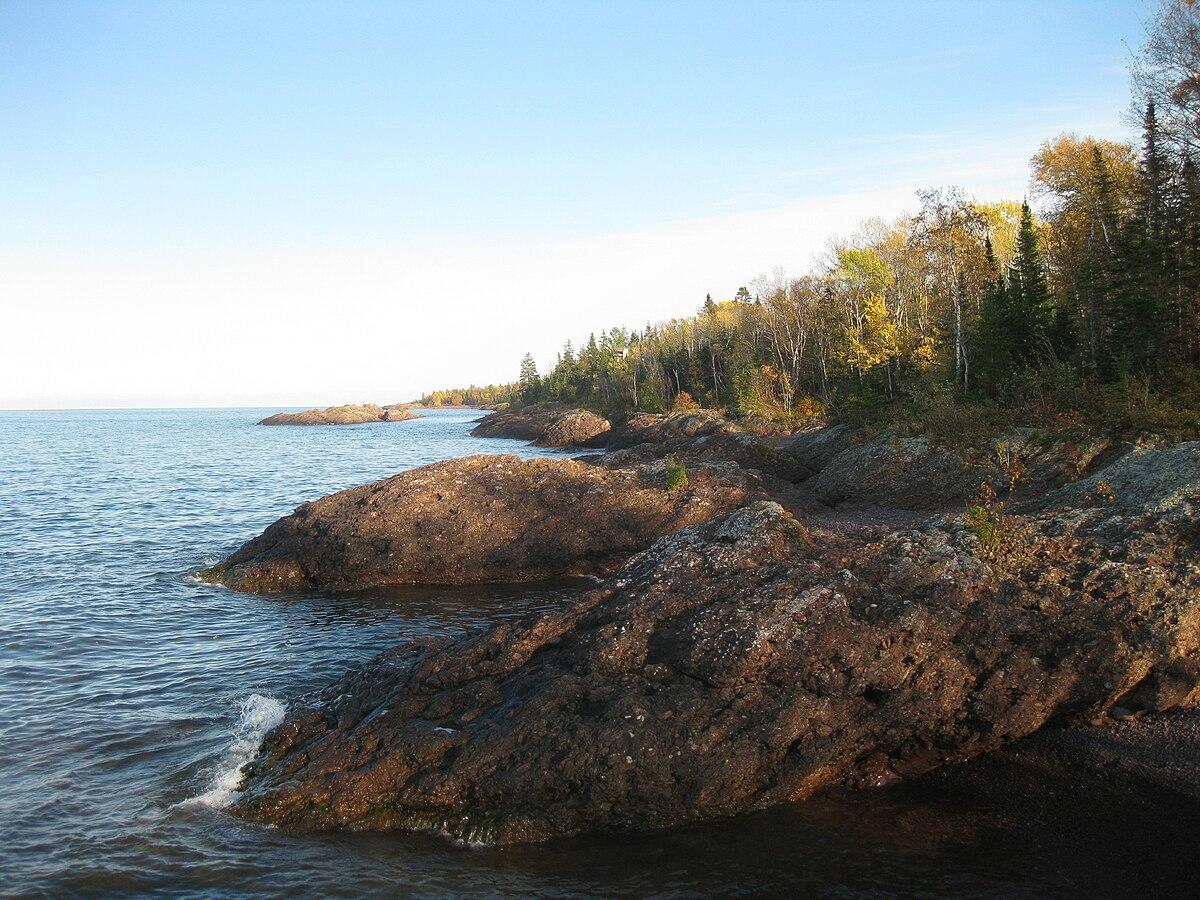 Rocky and forested coastline along Lake Superior.