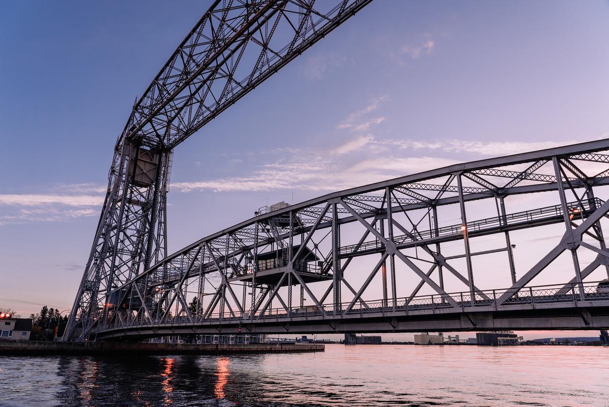 Silhouette of the Duluth Aerial Lift Bridge against a purple sunset. 